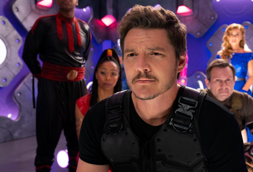 Pedro Pascal (center) stars as the leader of a group of adult superheroes who need to be saved by their kids in Netflix's "We Can Be Heroes."