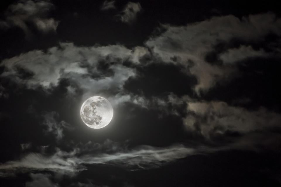 the moon in a cloudy sky
