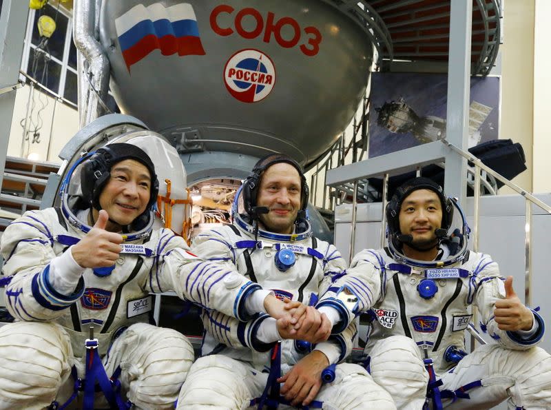 Cosmonaut Alexander Misurkin and space flight participants Yusaku Maezawa and Yozo Hirano attend a training session ahead of the expedition to the ISS, in Star City