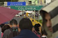<p>Venezuelan citizens wait in line to cross to Ecuador at the Rumichaca international bridge in Ipiales, Colombia, on Aug. 11, 2018. (Photo: Rodrigo Buendia/AFP/Getty Images) </p>