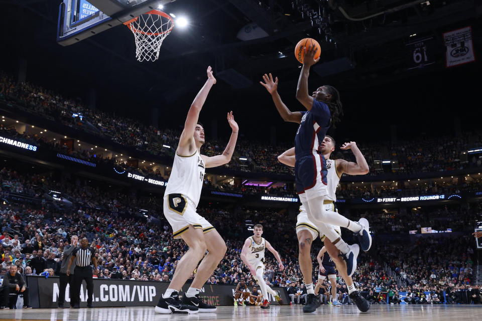 March 17, 2023;  Columbus, OH, USA;  Fairleigh Dickinson Knights guard Heru Bligen (3) kicks the ball over Purdue Boilermakers center Zach Edey (15) in the first half at Nationwide Arena.  Mandatory Credit: Rick Osentoski-USA TODAY Sports