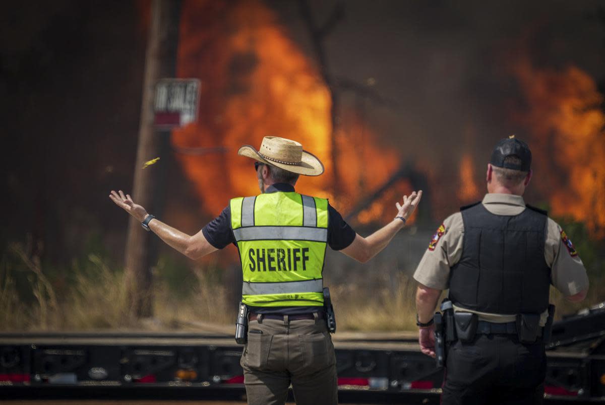 Bastrop County Sheriffs Department evacuated businesses and residences as multiple first responders including Bastrop Fire, Round Rock Fire, Austin Fire Department and Travis County ESD join together to fight a powder Keg Pine Fire in Bastrop on Tuesday Aug. 1, 2023.                                  