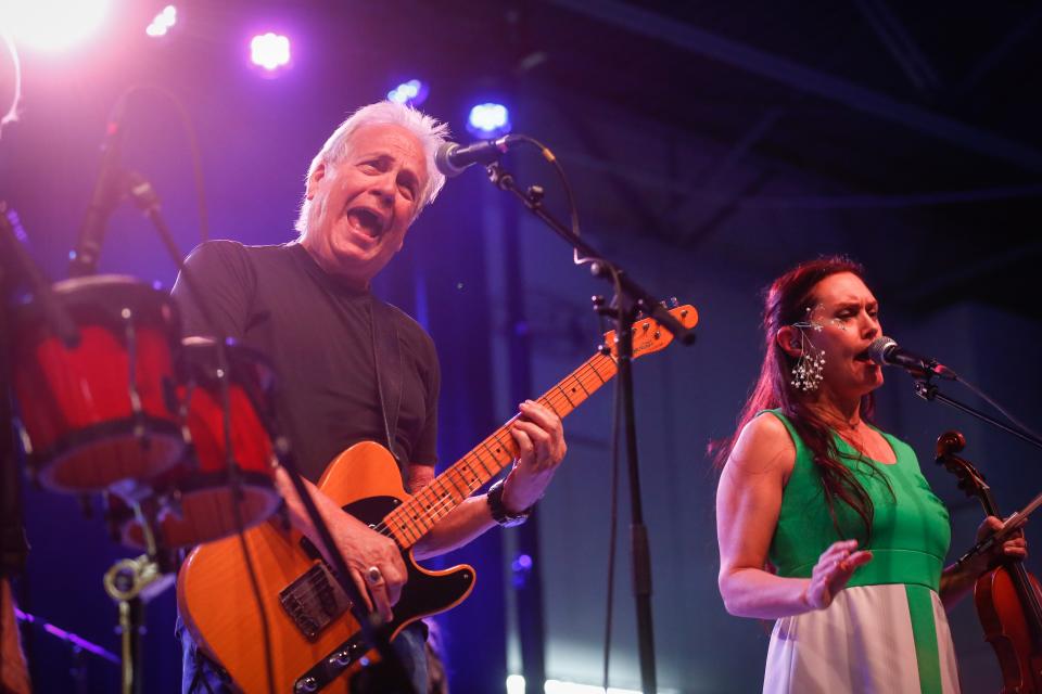 John Dillon, left, and Molly Healey of The Ozark Mountain Daredevils perform "Jackie Blue" during Springfield's second annual Earth Day Music and Sustainability Festival, at Jordan Valley Ice Park on Saturday, April 22, 2023.