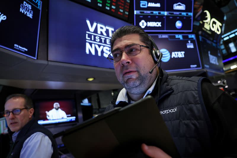 Traders work on the floor of the NYSE in New York