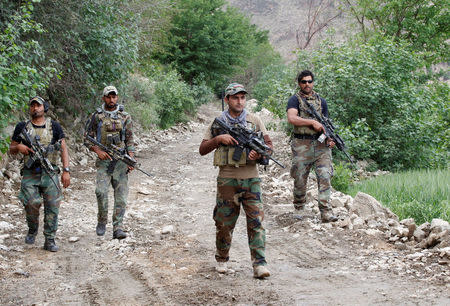 Afghan Special Forces patrol at the site of a MOAB, or ''mother of all bombs'', which struck the Achin district of the eastern province of Nangarhar, Afghanistan April 23, 2017. REUTERS/Parwiz