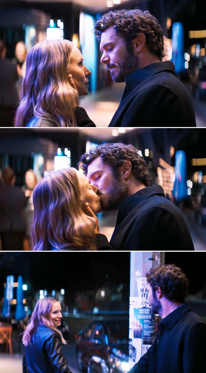 A scene from "Nobody wants that" where Kristen Bell and Adam Brody kiss on a sidewalk