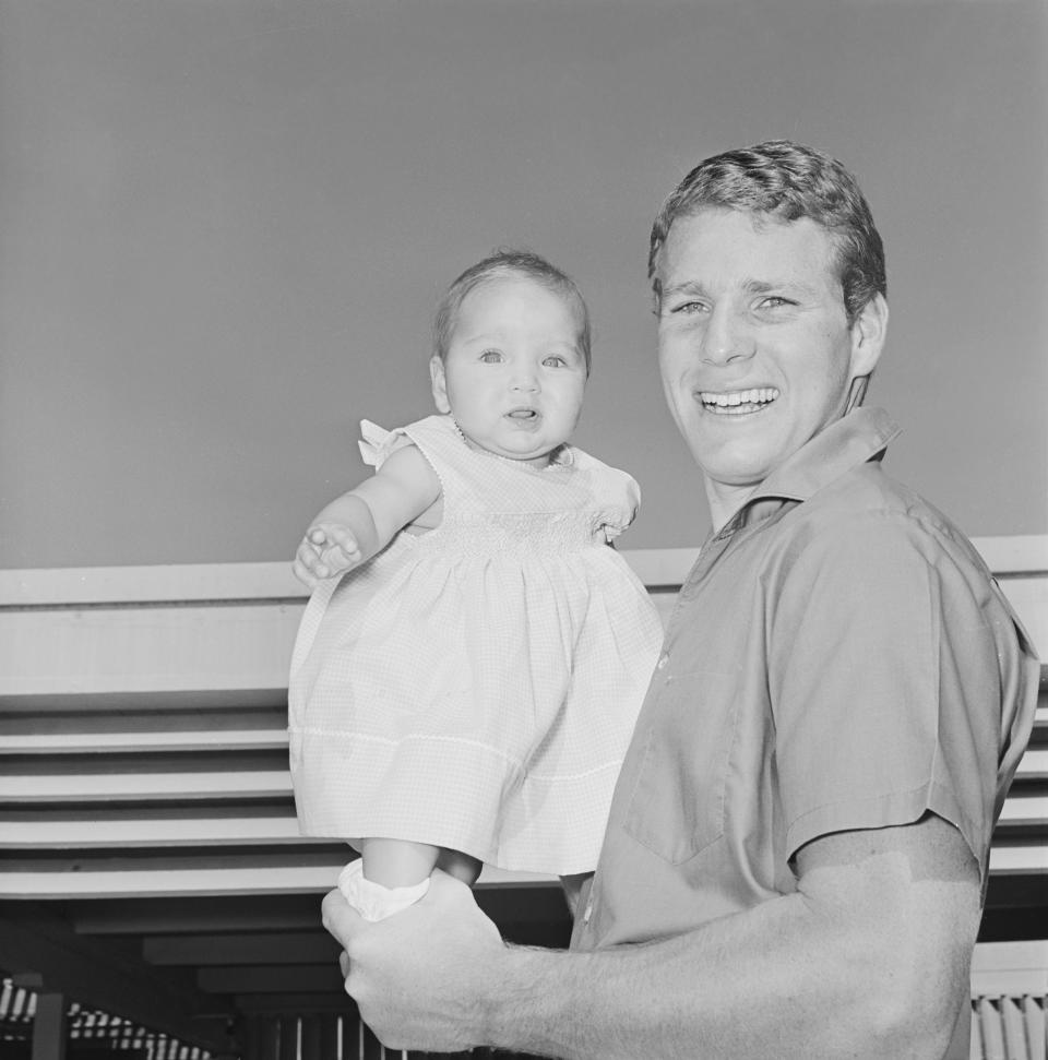 Ryan O'Neal holding his daughter Tatum