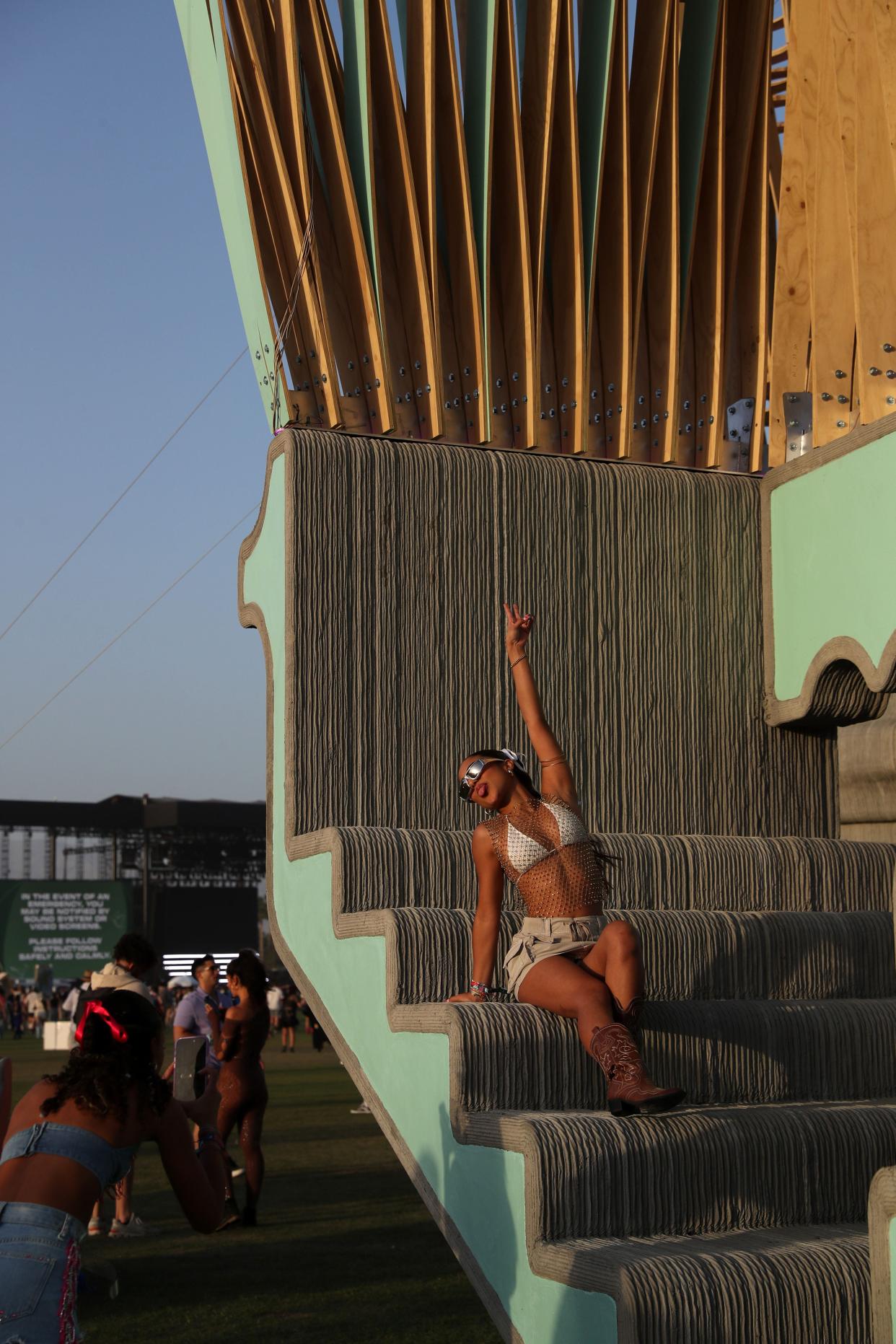 Festival goers take photos on the Monarchs: A House in Six Parts by Hannah at the Empire Polo Club during the Coachella Music and Arts Festival in Indio, Calif., on Friday.