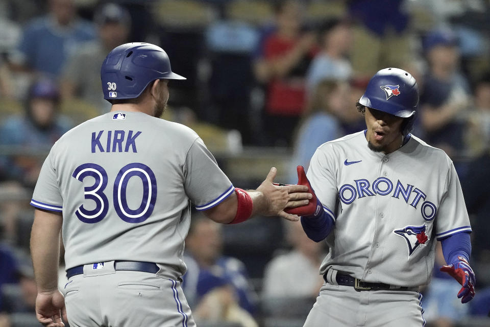 The Blue Jays could use some increased production from Alejandro Kirk and Santiago Espinal, right. (AP Photo/Charlie Riedel)
