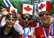 Team Canada fans await the start of the men's preliminary round ice hockey game against Norway at the Sochi 2014 Sochi Winter Olympics, February 13, 2014. REUTERS/Jim Young