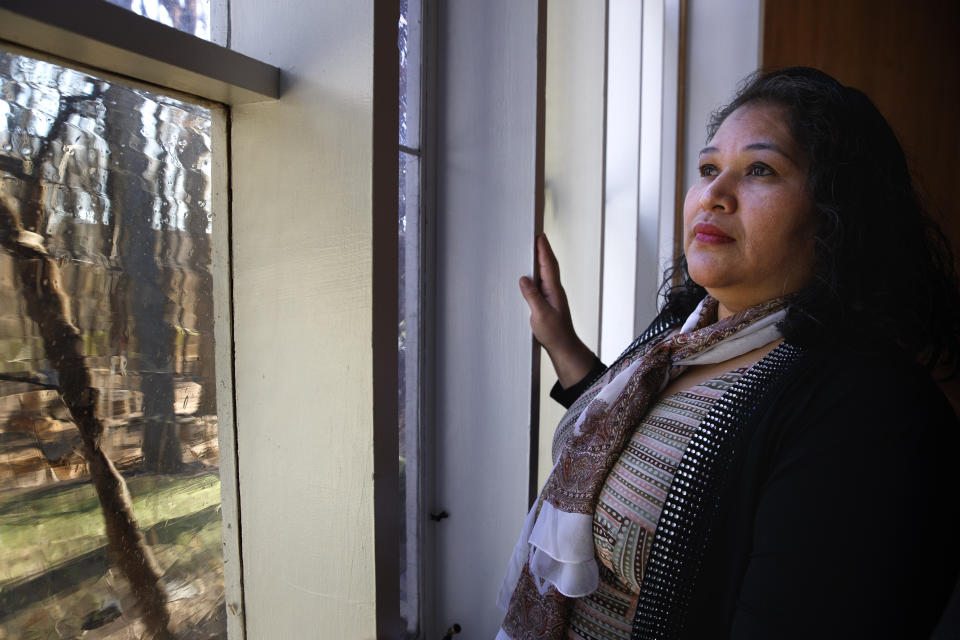 Rosa Gutierrez Lopez, from el Salvador, who a year ago became the first unauthorized immigrant to get refuge inside a religious institution in the Washington area, poses for a portrait at Cedar Lane Unitarian Universalist Church where she has been living in sanctuary for a year due to a deportation order, in Bethesda, Md., Thursday, Dec. 5, 2019. (AP Photo/Jacquelyn Martin)