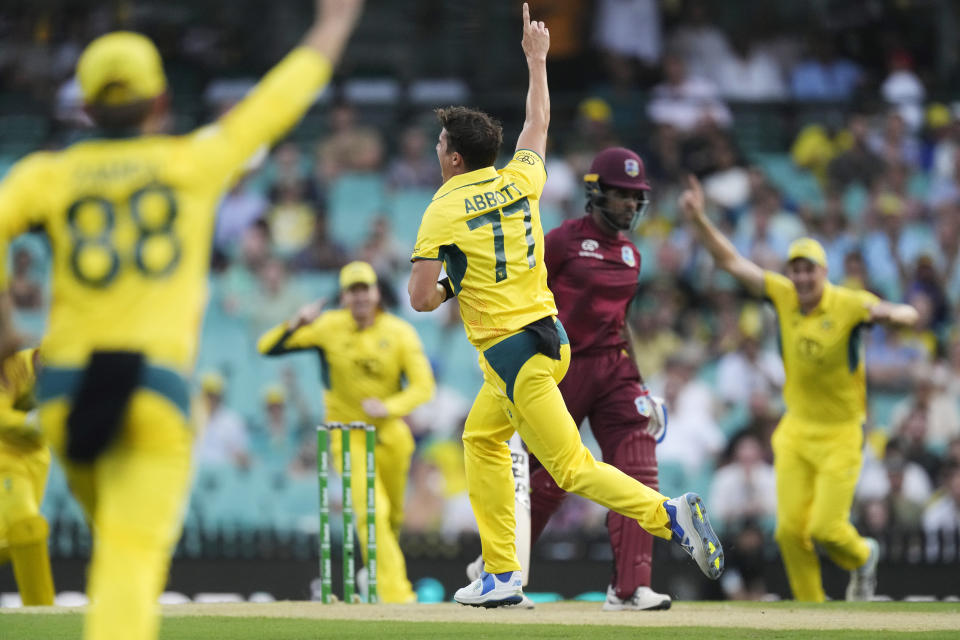 Australia's Sean Abbott, center, celebrates taking the wicket of the West Indies' Kjorn Ottley, second right, during their one day international cricket match in Sydney, Sunday, Feb. 4, 2024. (AP Photo/Rick Rycroft)