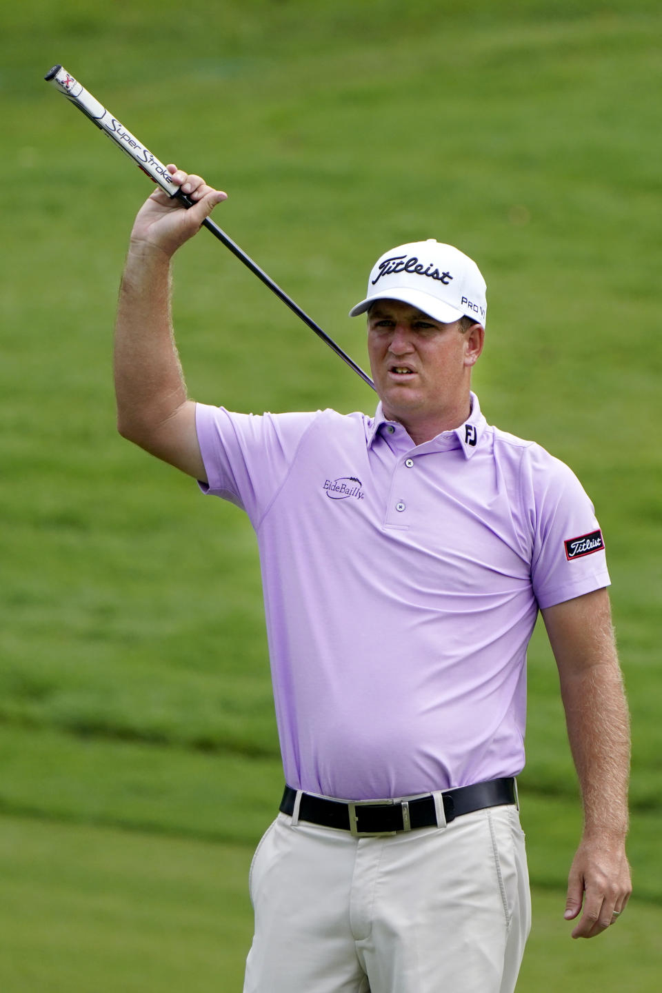 Tom Hoge scratches his back with his putter on the eighth green during the second round of the Wyndham Championship golf tournament at Sedgefield Country Club on Friday, Aug. 14, 2020, in Greensboro, N.C. (AP Photo/Chris Carlson)