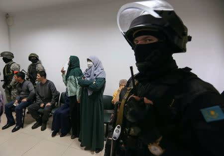 People attend a verdict hearing at a trial of Islamic State supporters, who attacked a National Guard facility in June, at a court in Aktobe, Kazakhstan, November 28, 2016. REUTERS/Stringer