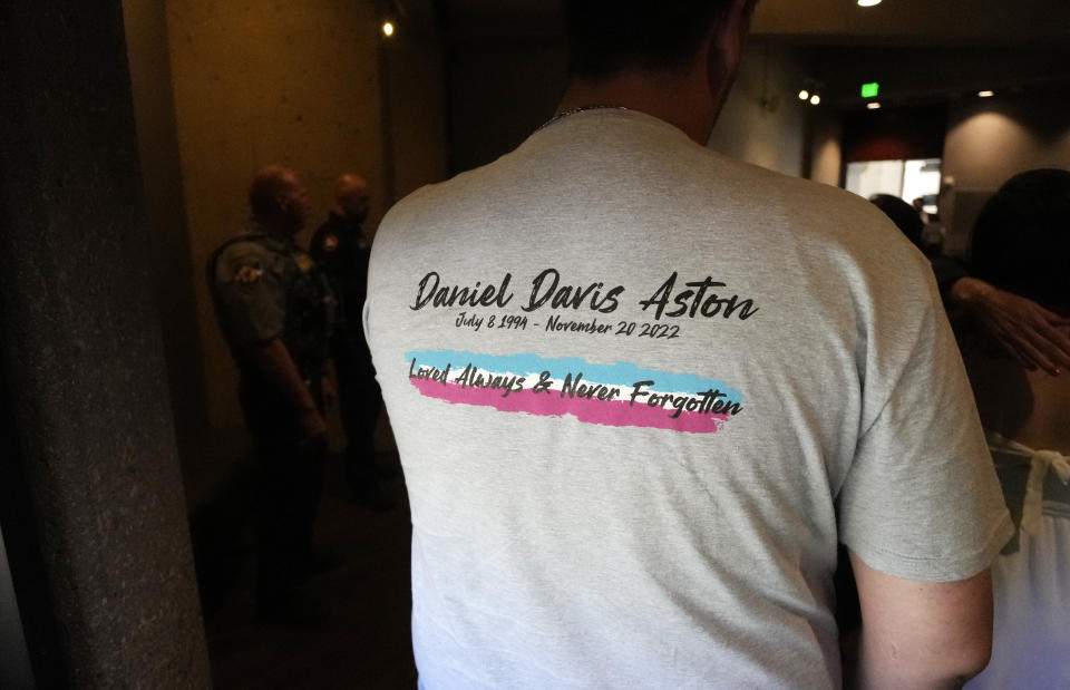 A man wears a shirt with the name of Daniel Davis Aston, who was one of the victims of the mass shooting at Club Q, during a news conference after a hearing for the suspect in the massacre at the gay nightclub Monday, June 26, 2023, in Colorado Springs, Colo. The suspect pleaded guilty in the attack that left five people dead and wounded multiple others just before Thanksgiving Day 2022 at the longtime sanctuary for the LGBTQ+ community in this mostly conservative city. (AP Photo/David Zalubowski)