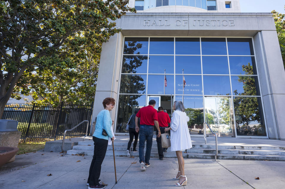 Violet Klaas, right, welcomes supporters of Polly Klaas, outside Santa Clara County Superior Court in San Jose, Calif., Friday, May 31, 2024. A California judge will consider Friday whether to recall the death sentence against Richard Allen Davis, who in 1993 killed 12-year-old Polly Klaas after kidnapping her from her bedroom at knifepoint in a crime that shocked the nation.(AP Photo/Nic Coury)