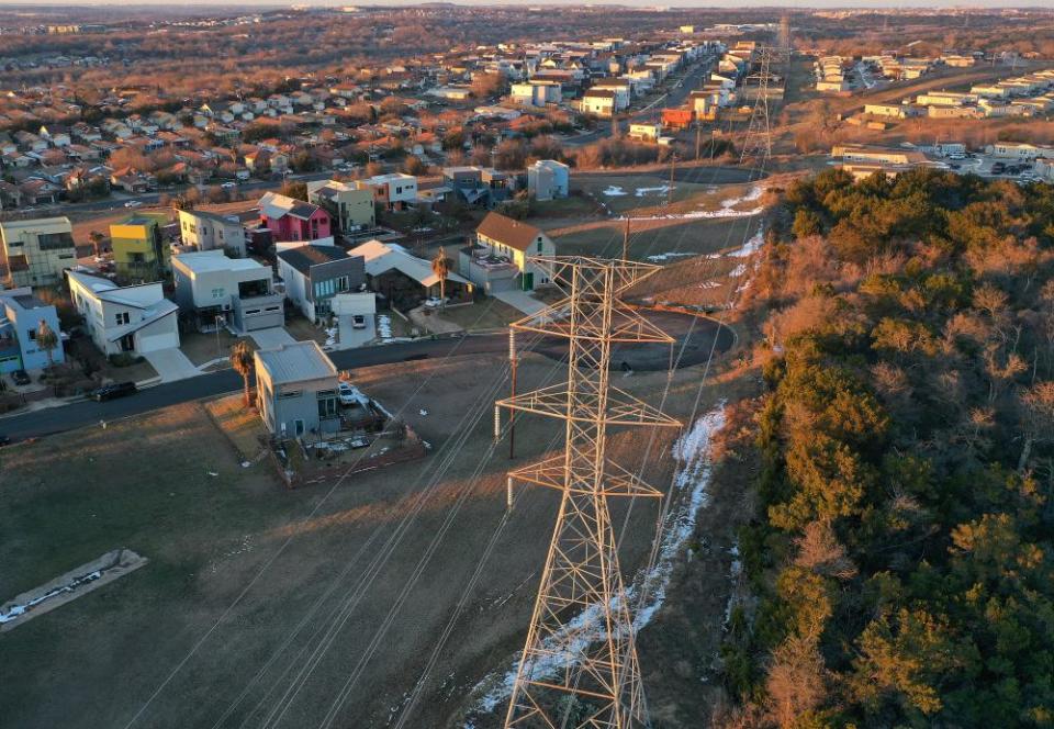 An aerial view of homes, buildings and electrical lines running through an Austin neighborhood on 19 February.