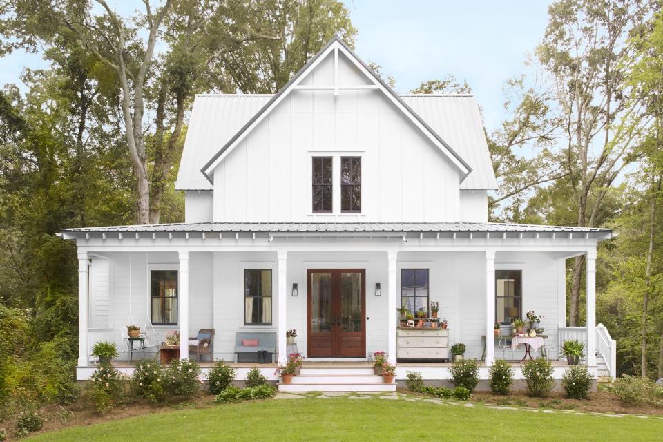 white farmhouse with large front porch