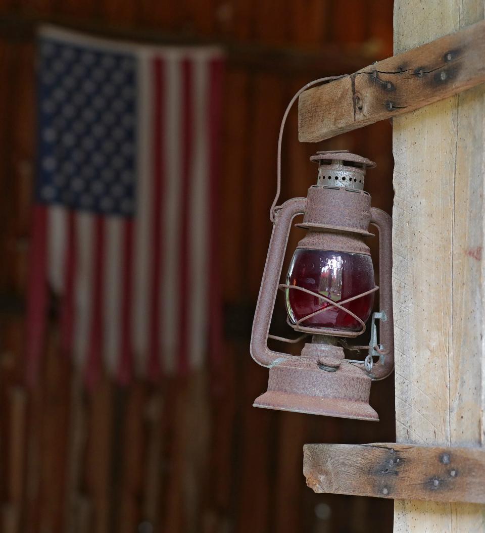 A lantern hangs in Scott Eller’s barn in Bath.