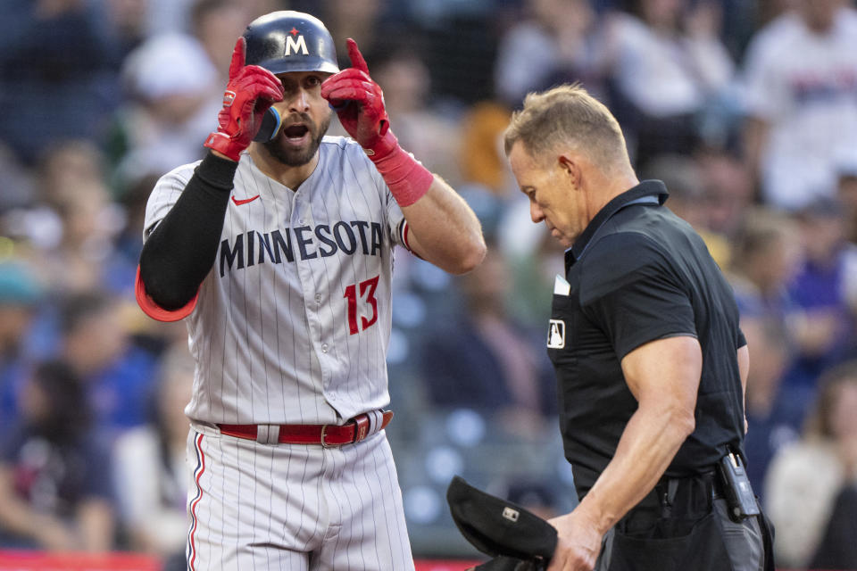 Minnesota Twins' Joey Gallo, left, celebrates after hitting a solo home run off Seattle Mariners relief pitcher Gabe Speier during the sixth inning of a baseball game, Monday, July 17, 2023, in Seattle. (AP Photo/Stephen Brashear)