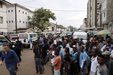 People are seen gathered outside the Connaught Hospital in Freetown, Sierra Leone August 16, 2017. REUTERS/Afolabi Sotunde