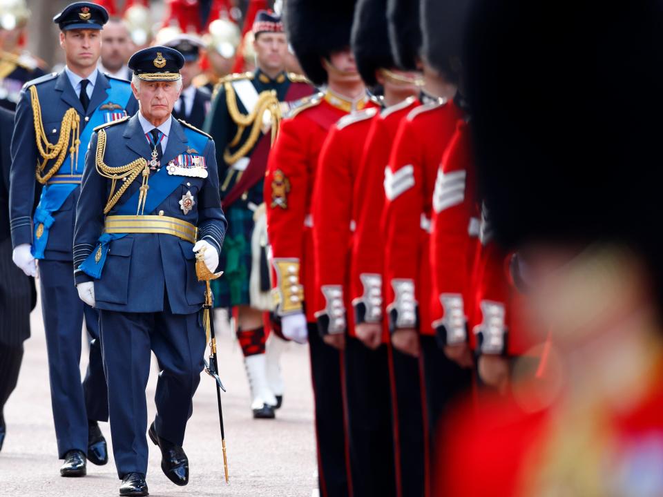 Prince William, Prince of Wales and King Charles III walk behind Queen Elizabeth II's coffin on September 14, 2022 in London, UK.