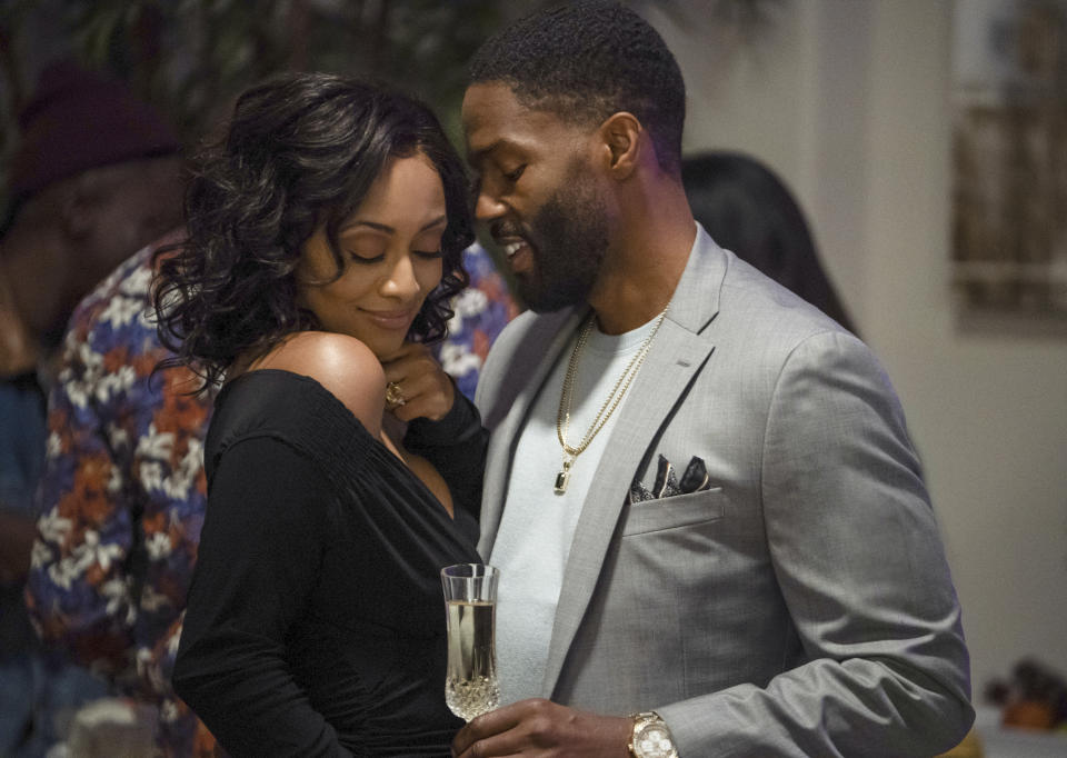 This image released by Lifetime shows Keri Hilson, left, and Tobias Truvillion in a scene from "Lust: A Seven Deadly Sins Story," premiering Saturday, April 10. (Lifetime via AP)