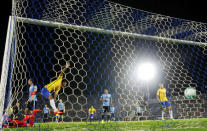 Football Soccer - Uruguay v Brazil - World Cup 2018 Qualifiers - Centenario stadium, Montevideo, Uruguay - 23/3/17 - Brazil's Paulinho (3rd L) scores his second goal. REUTERS/Andres Stapff