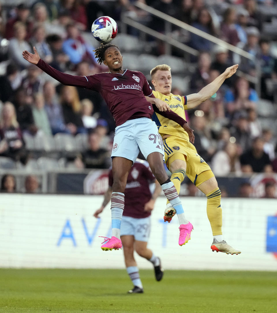 Colorado Rapids forward Kévin Cabral, left, heads the ball as Real Salt Lake defender Jasper Löffelsend defends in the first half of an MLS soccer match, Saturday, May 20, 2023, in Commerce City, Colo. (AP Photo/David Zalubowski)