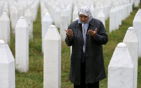 Hatidza Mehmedovic prays near the graves of her two sons and husband in Memorial Center in Potocari near Srebrenica, Bosnia and Herzegovina, October 17, 2016. REUTERS/Dado Ruvic