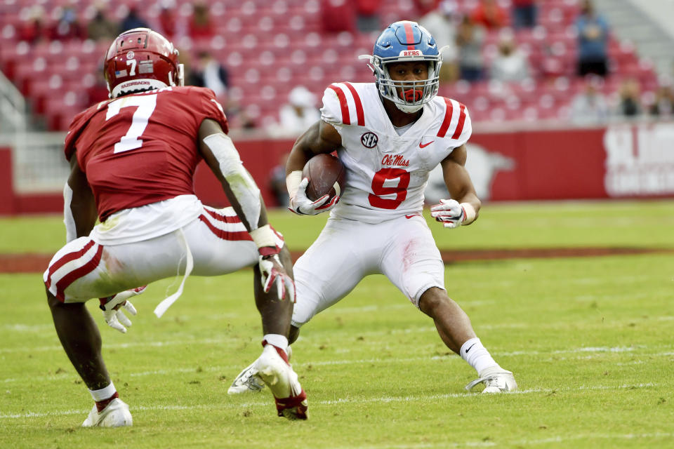 Mississippi running back Jerrion Ealy (9) tries to get past Arkansas defender Joe Foucha (70 during the second half of an NCAA college football game Saturday, Oct. 17, 2020, in Fayetteville, Ark. (AP Photo/Michael Woods)