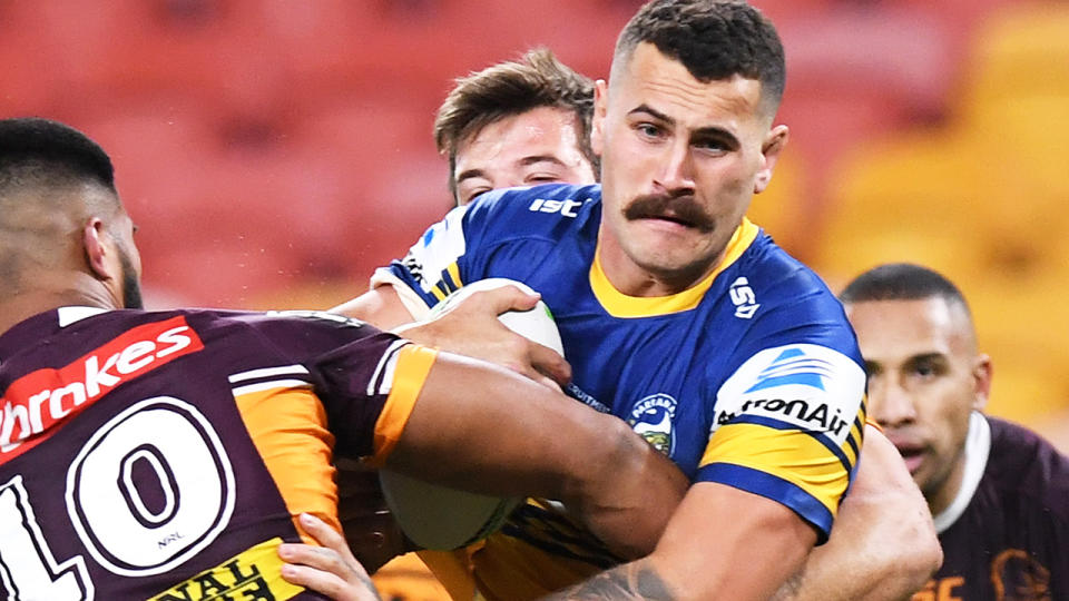 Reagan Campbell-Gillard of the Eels is tackled during the first match after the NRL's coronavirus-enforced hiatus. (Photo by Bradley Kanaris/Getty Images)