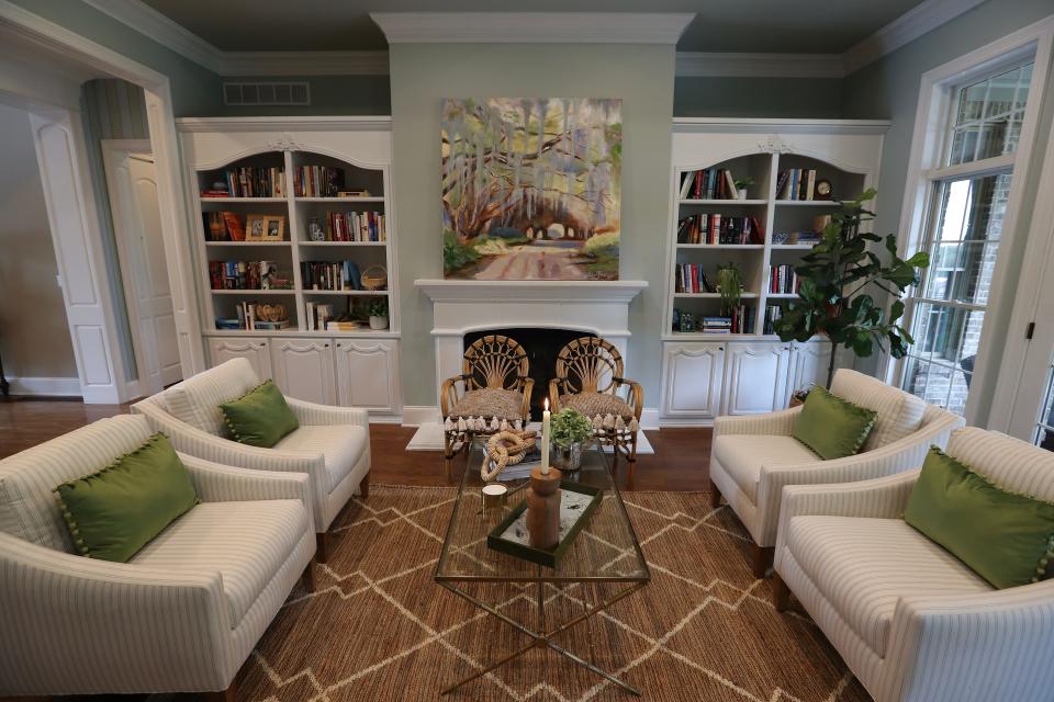 The sitting room inside the home of Susan Bunch in Elizabethtown, Ky. features a painting by her on July 13, 2023.