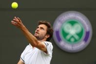 <p>Gilles Simon of France prepares to serve during the Men’s Singles second round match against Grigor Dimitrov of Bulgaria on day four of the Wimbledon Lawn Tennis Championships at the All England Lawn Tennis and Croquet Club on June 30, 2016 in London, England. (Photo by Julian Finney/Getty Images)</p>