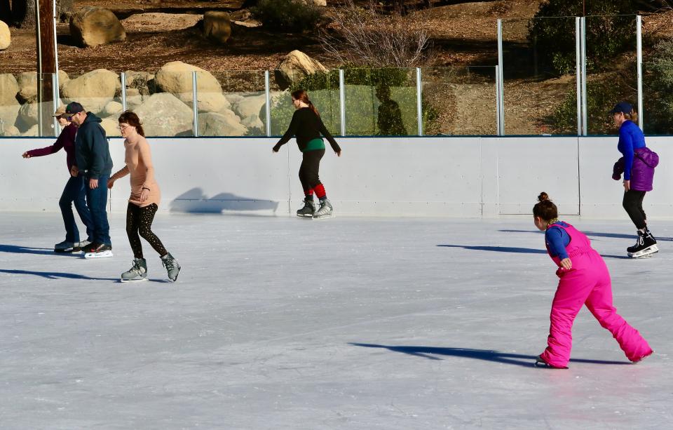 Skaters enjoy the Siskiyou Ice Rink at Shastice Park in Mount Shasta in January 2022.