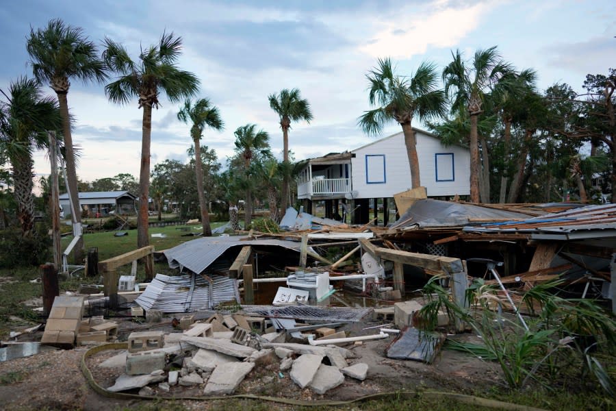 The remains of a destroyed building are seen in Horseshoe Beach, Fla., after the passage of Hurricane Idalia, Wednesday, Aug. 30, 2023. (AP Photo/Rebecca Blackwell)