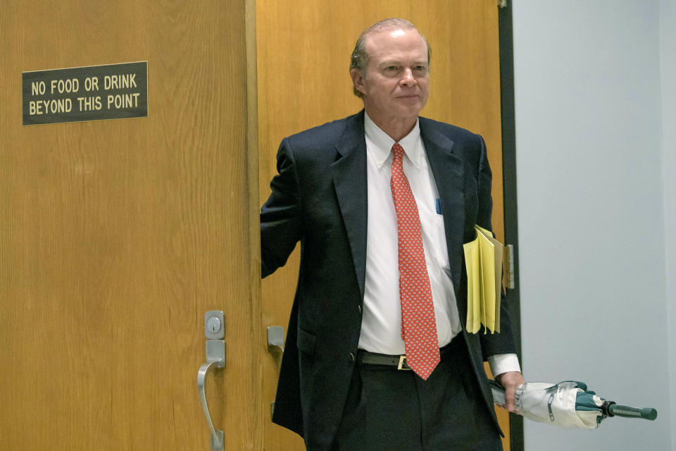 Edward Dirk Wegmann, attorney for the New Orleans Archdiocese, leaves a hearing at Orleans Parish Civil District Court in New Orleans, Thursday, Feb. 20, 2020. The New Orleans Saints headed to court Thursday in a bid to block the release of hundreds of confidential emails detailing the behind-the-scenes public relations work the team did for the area's Roman Catholic archdiocese amid its sexual abuse crisis. The request comes amid claims that the NFL team joined the Archdiocese of New Orleans in a “pattern and practice” of concealing sexual abuse — an allegation the Saints have vehemently denied. (AP Photo/Matthew Hinton)