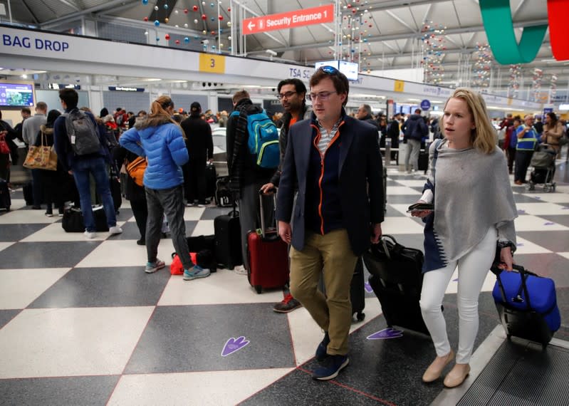 Travelers queue during the Thanksgiving holiday travel rush at O'Hare Airport in Chicago