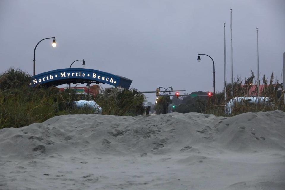 A man made dune was pushed up at the Main Street North Myrtle Beach access in an effort to block storm surge Friday expected from Hurricane Ian, which will make landfall later in the day. Sep. 30, 2022.