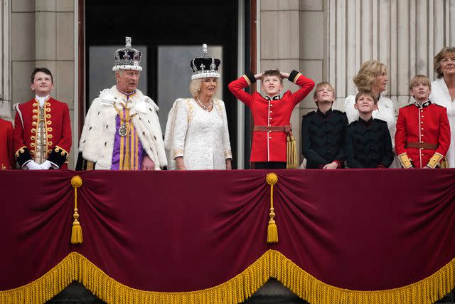 <p>Christopher Furlong/Getty</p> Nicholas Barclay, King Charles, Queen Camilla, Freddy Parker Bowles, Louis Lopes, Annabel Elliot, Gus Lopes and Arthur Elliot on the Buckingham Palace balcony following the coronation ceremony on May 6, 2023.