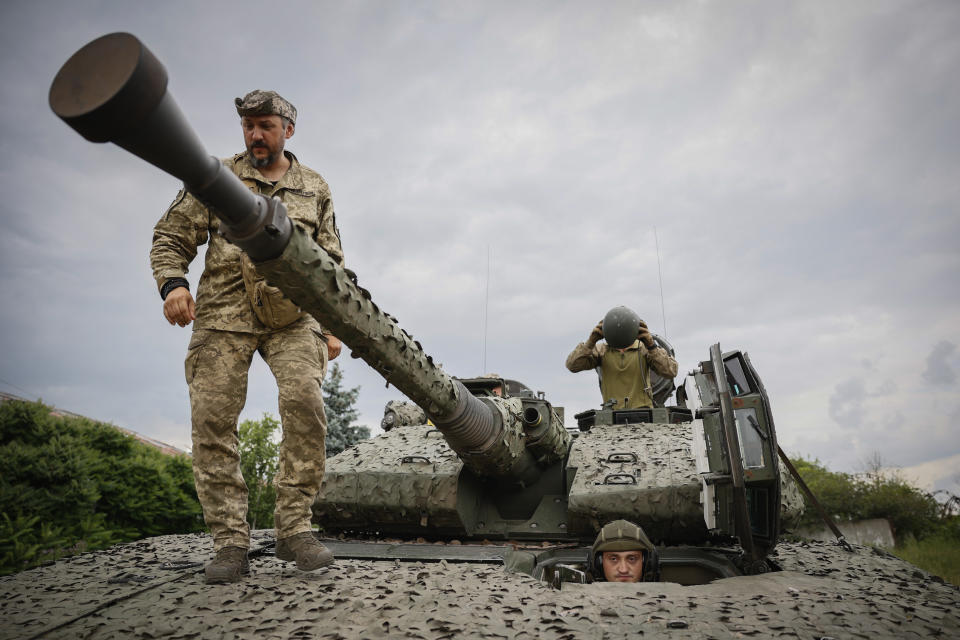 Ukrainian soldiers on a Swedish CV90 infantry fighting vehicle at their positions near Bakhmut, Donetsk region, Ukraine, Sunday, June 25, 2023. (Roman Chop via AP)