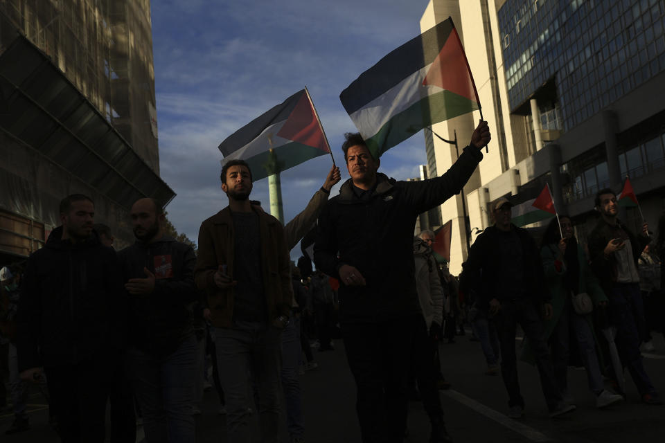 Protesters wave Palestinian flags during a demonstration to support the Palestinian people in Gaza, Saturday, Nov. 4, 2023 in Paris. (AP Photo/Aurelien Morissard)