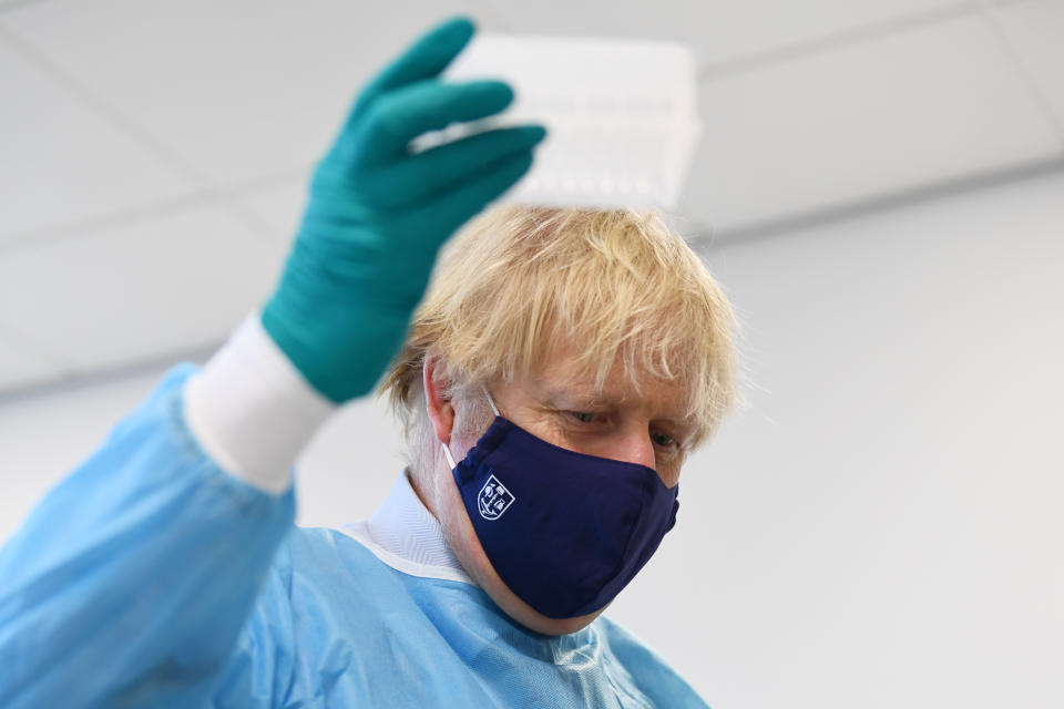 GLASGOW, SCOTLAND - JANUARY 28: British Prime Minister Boris Johnson is shown the Lighthouse Laboratory used for processing PCR samples, during a visit to the Queen Elizabeth University Hospital campus on January 28, 2021 in Glasgow, United Kingdom. Boris Johnson visits frontline keyworkers stating that there are great benefits of co-operating across the whole of the UK to beat the coronavirus pandemic. Opinion polls in Scotland show rising support for independence ahead of May's Holyrood elections. (Photo by Jeff J Mitchell/Getty Images)