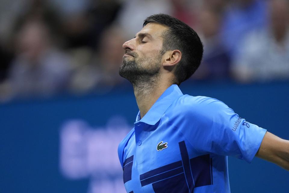 Novak Djokovic, of Serbia, reacts during a third-round match against Alexei Popyrin, of Australia, of the US Open tennis championship, Friday, Aug. 30, 2024, in New York. (AP Photo/Julia Nikhinson)