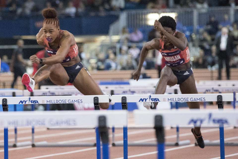 Sharika Nelvis, left, competes in the women's 60-meter hurdles at the Millrose Games track and field meet, Saturday, Feb. 9, 2019, in New York. (AP Photo/Mary Altaffer)