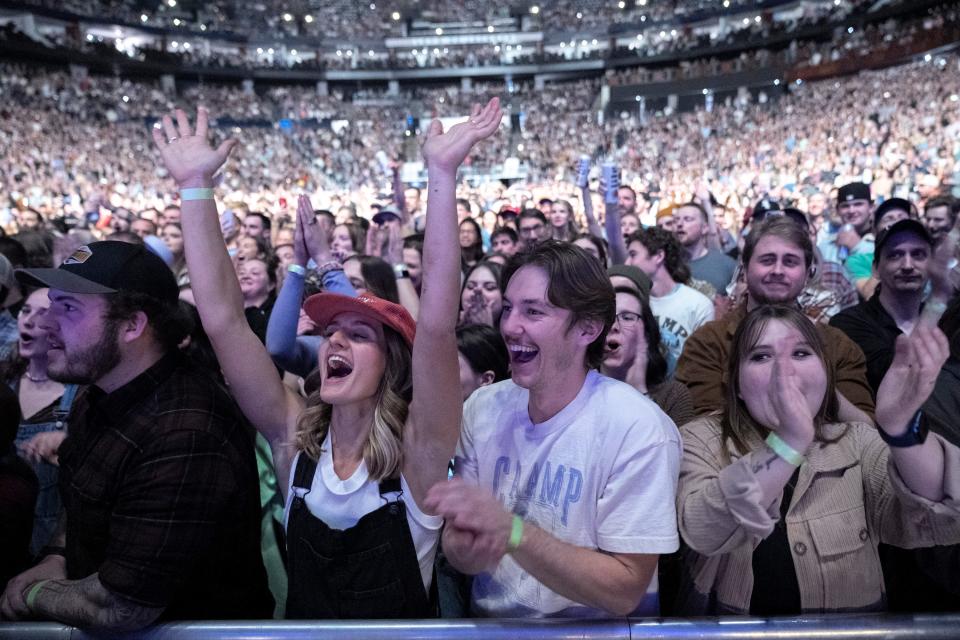 Fans cheer as Caamp enters the stage at Nationwide Arena.