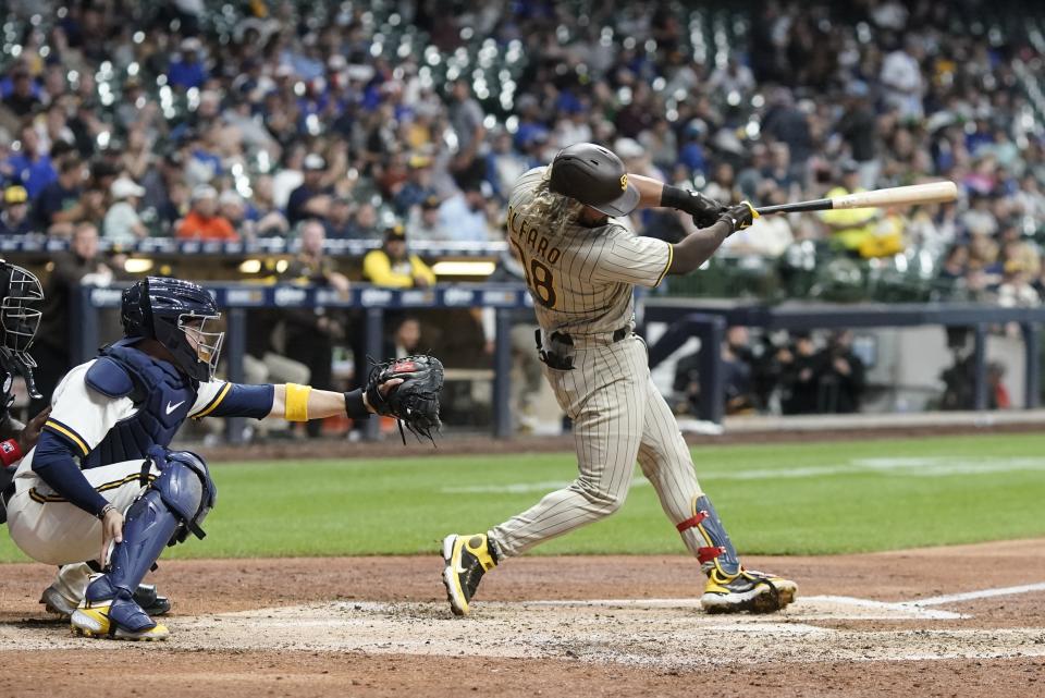 San Diego Padres' Jorge Alfaro hits a two-run home run during the sixth inning of a baseball game against the Milwaukee Brewers Thursday, June 2, 2022, in Milwaukee. (AP Photo/Morry Gash)