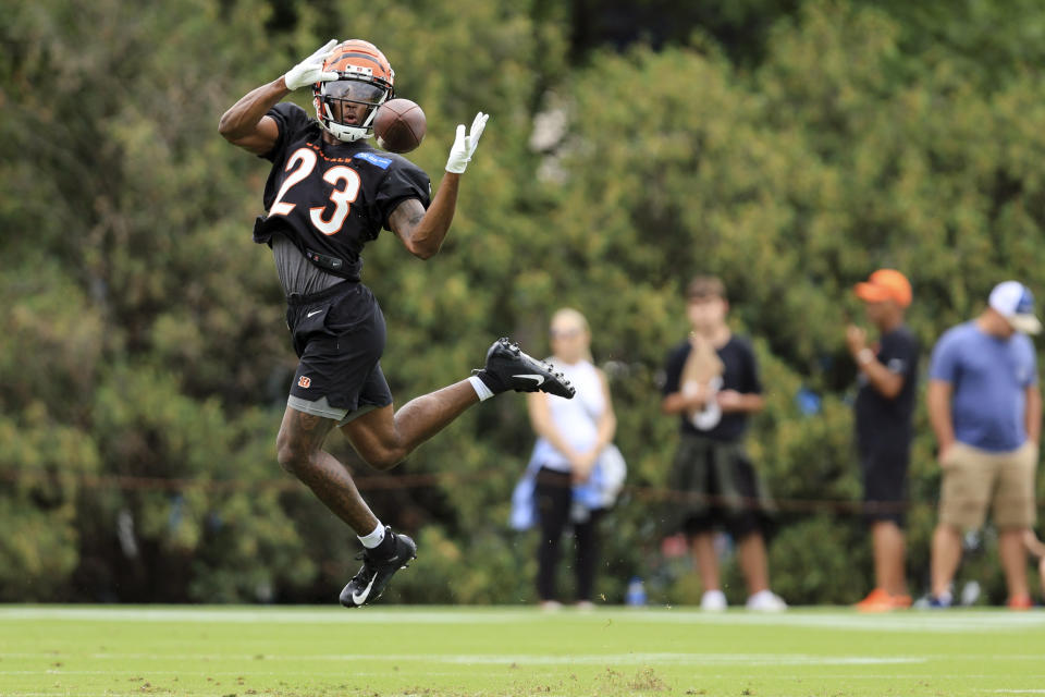 Cincinnati Bengals' Dax Hill makes a catch during the NFL football team's training camp in Cincinnati, Wednesday, July 27, 2022. (AP Photo/Aaron Doster)