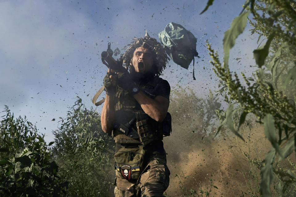 A Ukrainian serviceman of the 53rd brigade fires a RPG-9 towards Russian positions at the frontline close to Donetsk, Ukraine, Saturday, Aug. 19, 2023. (AP Photo/ Libkos)