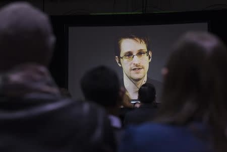 Former U.S. National Security Agency contractor Edward Snowden appears live via video during a student organized world affairs conference at the Upper Canada College private high school in Toronto, February 2, 2015. REUTERS/Mark Blinch